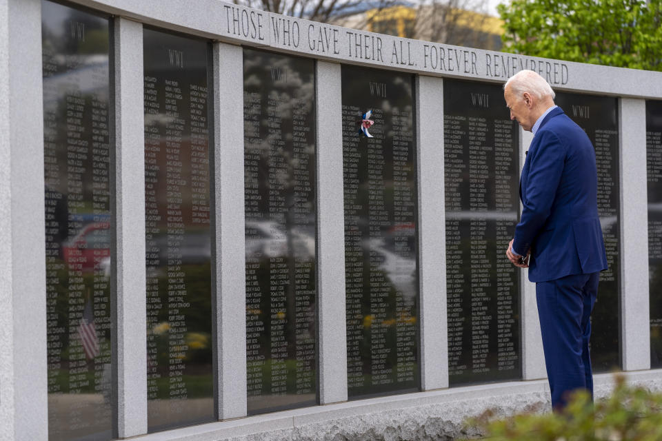 President Joe Biden pauses at a wall of veterans' names at a Scranton war memorial, Wednesday, April 17, 2024, in Scranton, Pa. (AP Photo/Alex Brandon)