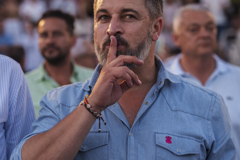 VOX far right party leader Santiago Abascal asks for silence before listening the Spanish national anthem during an election campaign event in Guadalajara, Spain, Saturday, July 15, 2023. Spain's elections Sunday will be a battle between two leftist and two rightist parties that are teaming up to form possible coalitions. Abascal likes to style himself as an outsider who has arrived on the mission to save Spain's soul. (AP Photo/Manu Fernandez)