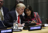 President Donald Trump talks to Nikki Haley, the U.S. ambassador to the United Nations, at the United Nations General Assembly, Monday, Sept. 24, 2018, at U.N. Headquarters. (AP Photo/Evan Vucci)