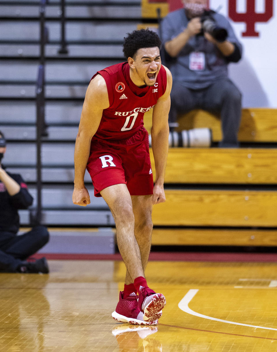 Rutgers guard Geo Baker (0) reacts after hitting a 3-point basket during the second half of an NCAA college basketball game against Indiana, Sunday, Jan. 24, 2021, in Bloomington, Ind. (AP Photo/Doug McSchooler)