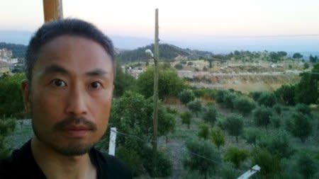 Japanese journalist Jumpei Yasuda, who is seen in this photo sent by e-mail to a Kyodo News photographer on June 23, 2015 before Yasuda's departure to Syria, with the message reading,