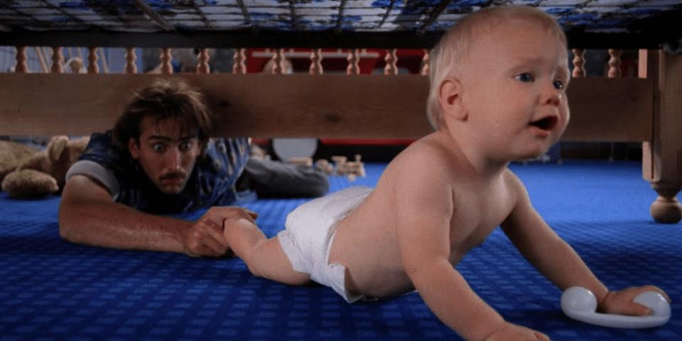 Nicolas Cage chases after a baby in a scene from "Raising Arizona."