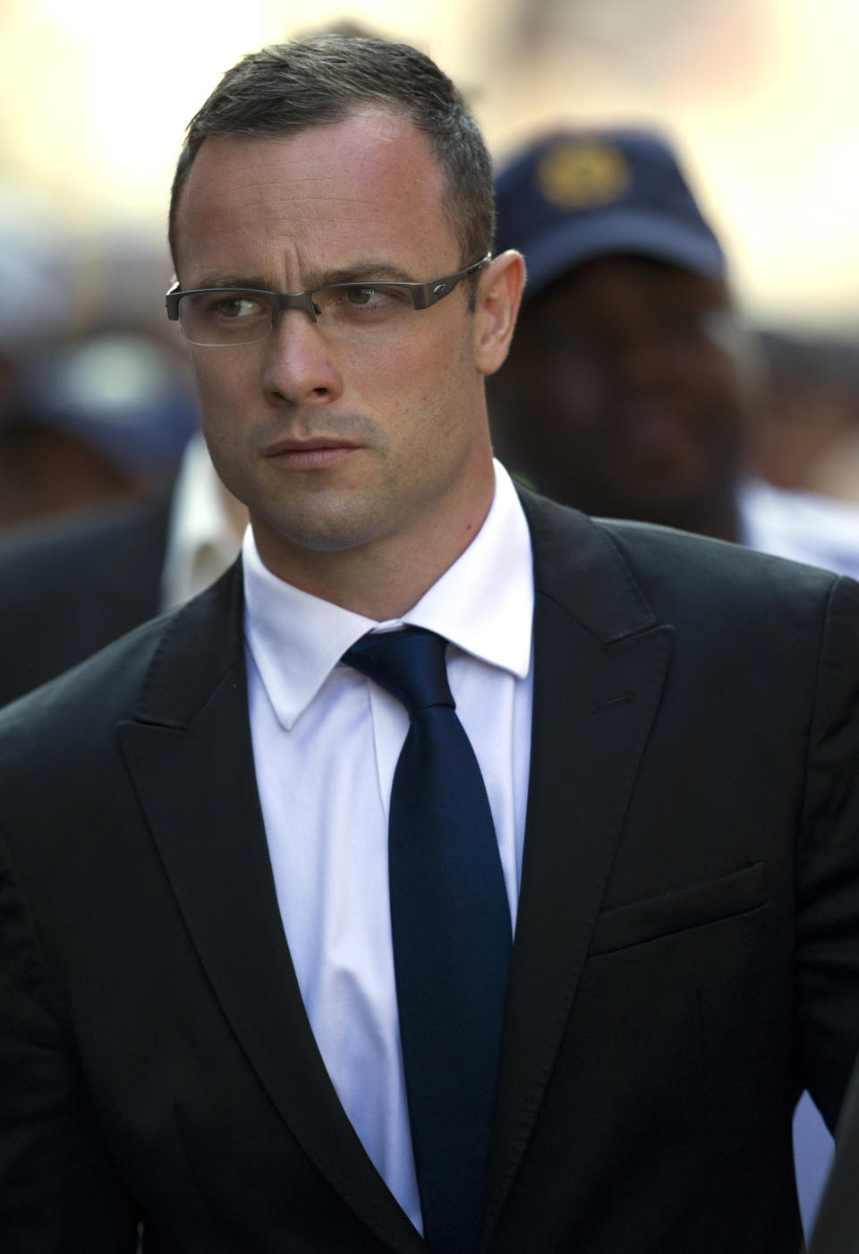 Oscar Pistorius arrives at the high court for his murder trial in Pretoria, South Africa, Monday, March 17, 2014. Pistorius is charged with murder for the shooting death of his girlfriend, Reeva Steenkamp, on Valentines Day in 2013. (AP Photo/Themba Hadebe)