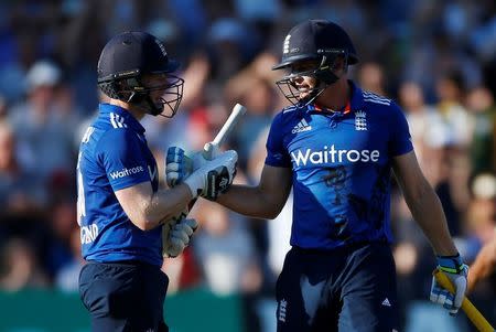 Britain Cricket - England v Pakistan - Third One Day International - Trent Bridge - 30/8/16 England's Jos Buttler and Eoin Morgan celebrate at the end of the innings after breaking the world record for the highest ODI score Action Images via Reuters / Paul Childs Livepic