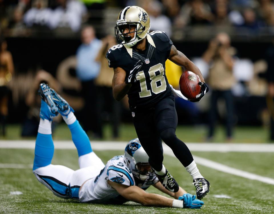 NEW ORLEANS, LA - DECEMBER 07: Jalen Saunders #18 of the New Orleans Saints runs the ball as Ben Jacobs #53 of the Carolina Panthers tries turnover defend during the first quarter at Mercedes-Benz Superdome on December 7, 2014 in New Orleans, Louisiana. (Photo by Sean Gardner/Getty Images)