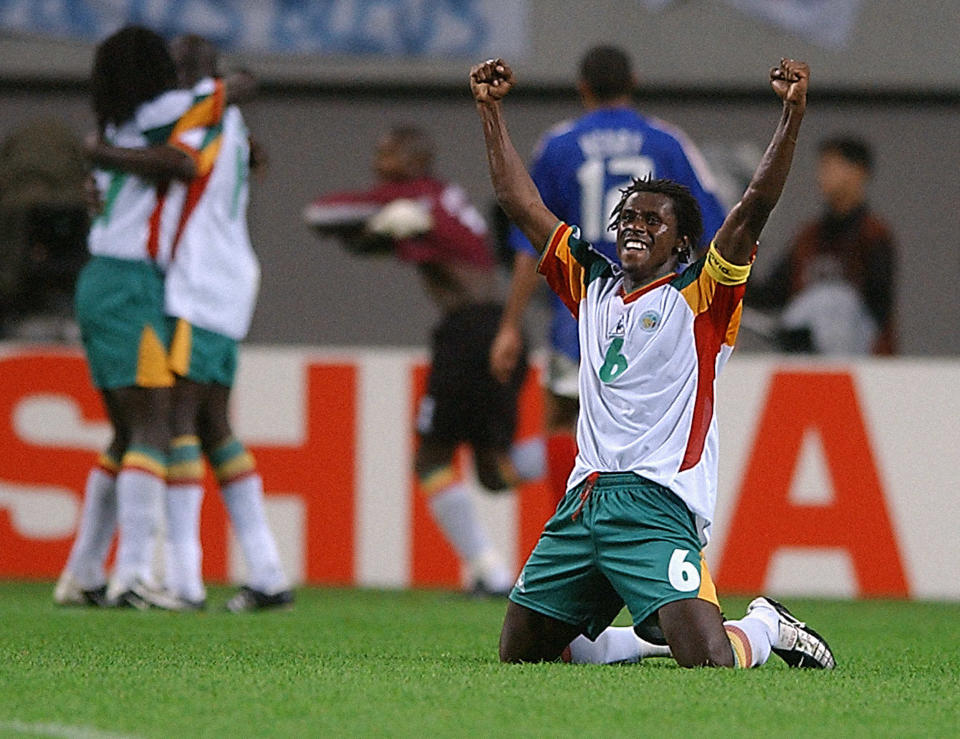 Senegal captain Aliou Cisse celebrates their shock win