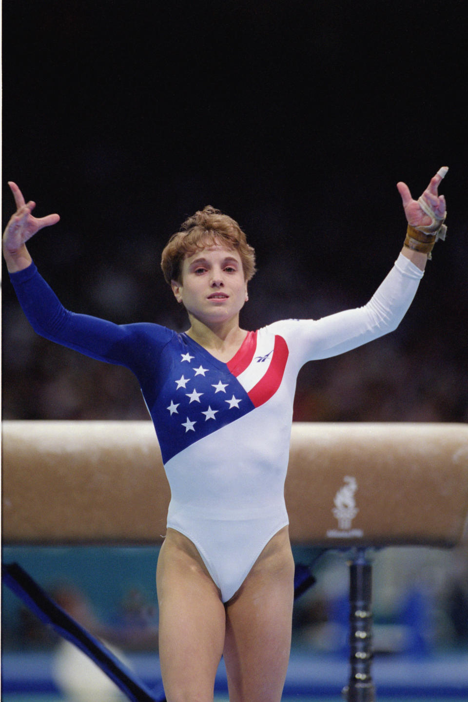 ATLANTA - JULY 23:  Kerri Strug of the United States sticks the landing on her second attempt while competing in the vault, part of the Womens Team Gymnastics competition at the 1996 Olympic Games on July 23, 1996 at the Georgia Dome in Atlanta, Georgia.  (Photo by Mike Powell/Getty Images)