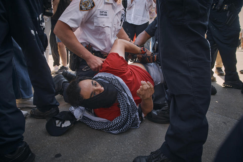 New York City police officers detain a pro-Palestinian demonstrator during a protest demanding a permanent cease-fire in Gaza on Friday, May 31, 2024, in the Brooklyn borough of New York. (AP Photo/Andres Kudacki)