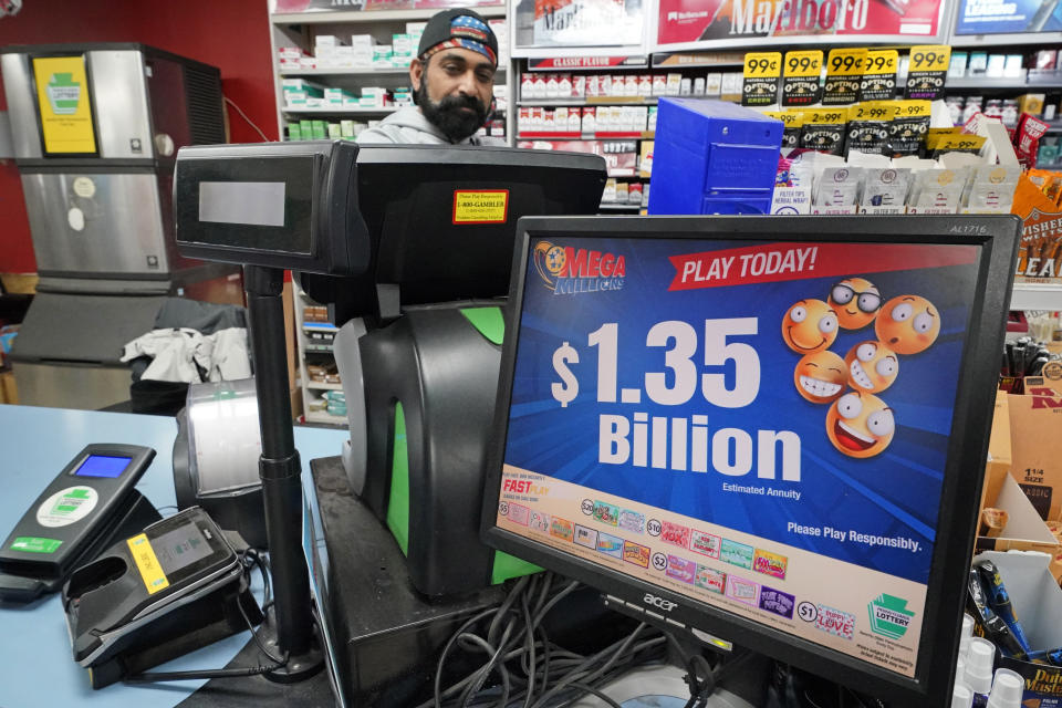 A Mega Million sign displays the estimated jackpot of $1.35 Billion at the Cranberry Super Mini Mart in Cranberry, Pa., Thursday, Jan. 12, 2023. After twenty-five consecutive drawings, with no grand prize winner named, the Mega Millions jackpot is now $1.35 billion, making it one of the largest jackpots in lottery history. (AP Photo/Gene J. Puskar)