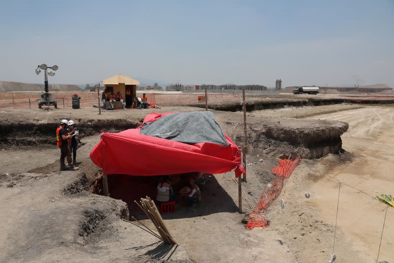 Archaeologists from the National Institute of Anthropology and History (INAH) work at a site where they are unearthing remains of mammoths, in Zumpango