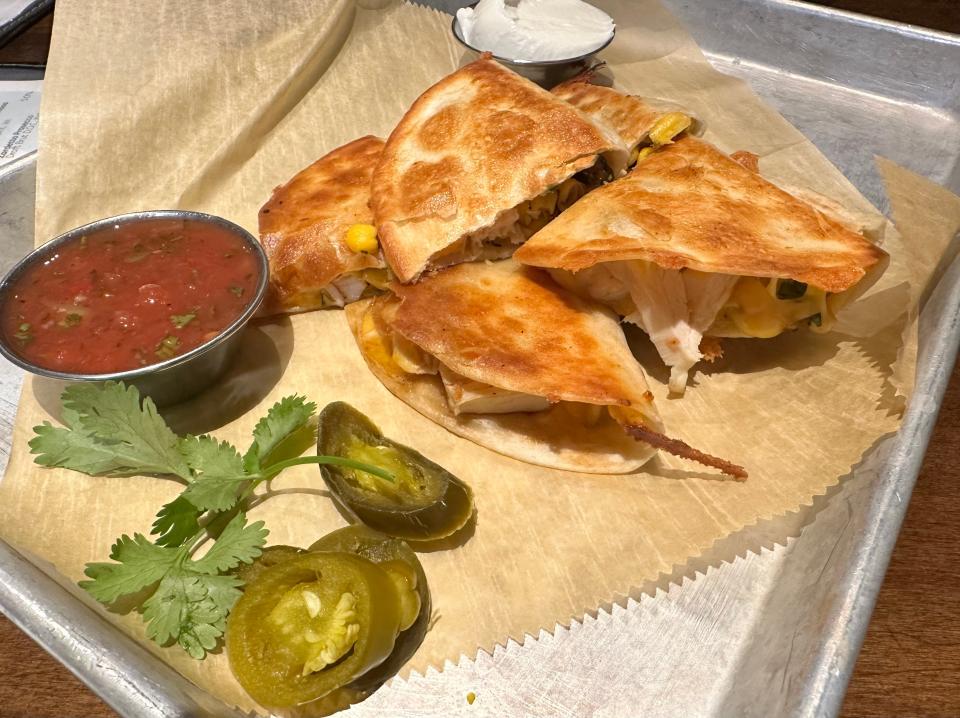 The table quesadilla at Table Six Kitchen + Bar is a standout appetizer, especially at happy hour pricing.