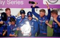 Cricket - England v New Zealand - Fifth Royal London One Day International - Emirates Durham ICG - 20/6/15 England's Eoin Morgan celebrates with the trophy and team mates after winning the Fifth Royal London One Day International Action Images via Reuters / Phil Noble Livepic