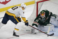 Minnesota Wild goaltender Kaapo Kahkonen (34) blocks a shot on goal by Nashville Predators center Colton Sissons (10) in the first period of an NHL hockey game, Sunday, Oct. 24, 2021, in St. Paul, Minn. (AP Photo/Andy Clayton-King)