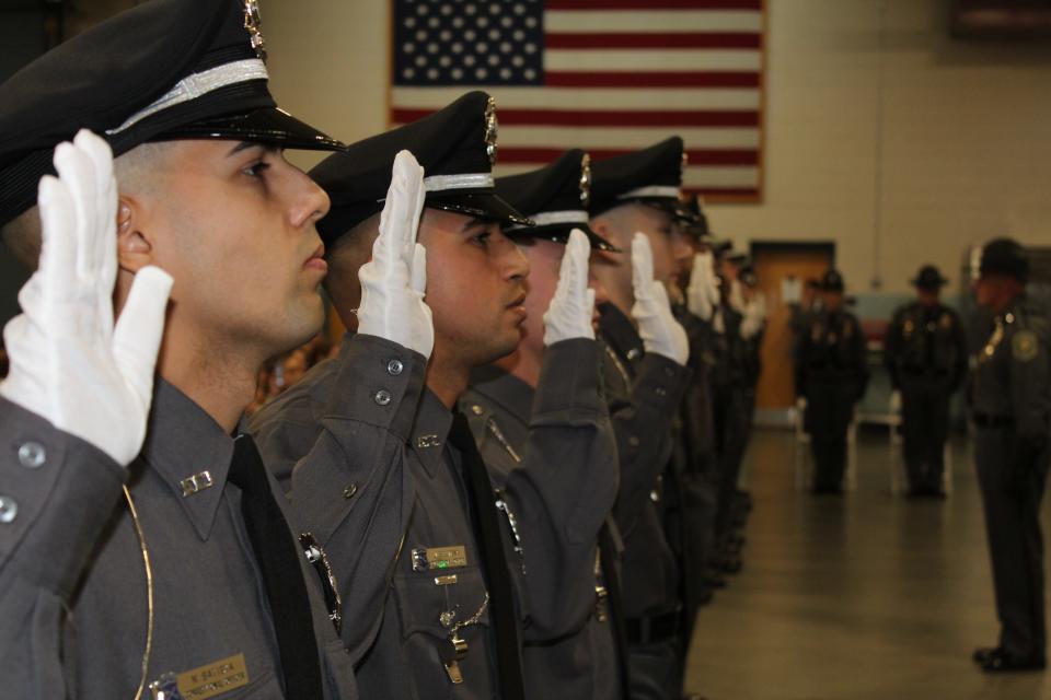 New corrections officers take the oath in 2022. Recruitment is falling far short of the corrections department's needs, with about a third of its 900 officers eligible for retirement in the coming year.