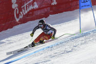 Canada's James Crawford speeds down the course during the super G portion of the men's combined race, at the alpine ski World Championships, in Cortina d'Ampezzo, Italy, Monday, Feb. 15, 2021. (AP Photo/Marco Tacca)