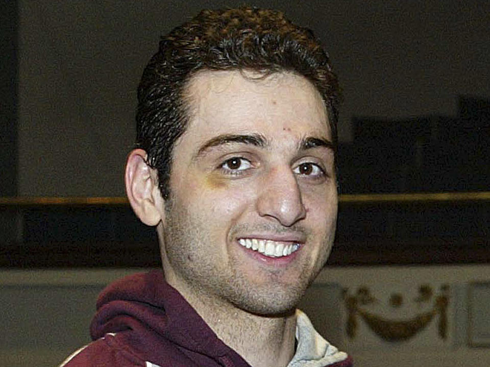 FILE - In this Feb. 17, 2010, photo, Tamerlan Tsarnaev smiles after accepting the trophy for winning the 2010 New England Golden Gloves Championship in Lowell, Mass. Tsarnaev is the Boston Marathon bombing suspect who was killed in a police shootout. Peter Stefan, the owner of a Worcester funeral home, said he still feels disturbed by the reaction he got when he agreed to take the remains of Tamerlan Tsarnaev last year after a funeral home in North Attleborough, where the body was initially sent, was picketed by protesters. Stefan is writing a book about his experience. (AP Photo/The Lowell Sun, Julia Malakie, File) MANDATORY CREDIT
