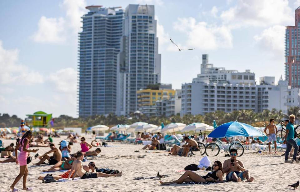 People visit South Beach during spring break on Friday, March 15, 2024, in Miami Beach.