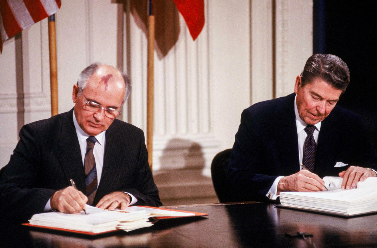 Soviet Union President Mikhail Gorbachev and U.S. President Ronald Reagan sign the Intermediate-range Nuclear Forces agreement in the East Room of the White House on Dec. 8, 1987. (Dirck Halstead / Getty Images file)