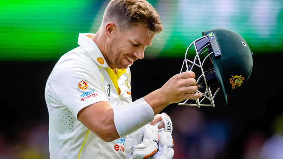 Australia batter David Warner removes his helmet after losing his wicket against South Africa in the first Test at the Gabba.