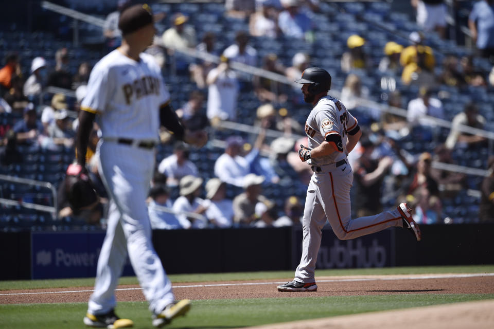 San Francisco Giants' Darin Ruf, right, rounds the bases after hitting a two-run home run off of San Diego Padres starting pitcher Blake Snell during the second inning of a baseball game in San Diego, Wednesday, April 7, 2021. (AP Photo/Kelvin Kuo)