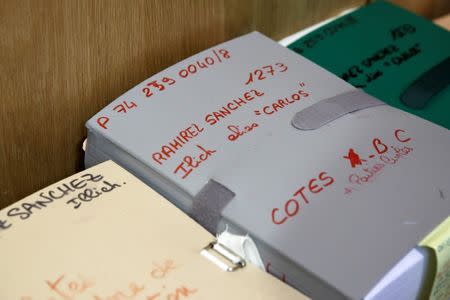 Files are seen in the courtroom before the opening of the trial of Ilich Ramirez Sanchez, known as Carlos the Jackal, in Paris, France March 13, 2017. Carlos the Jackal is appearing in a Paris court for a deadly 1974 attack at a shopping arcade in the French capital, a trial that victims’ families have been awaiting for decades. REUTERS/Benoit Tessier