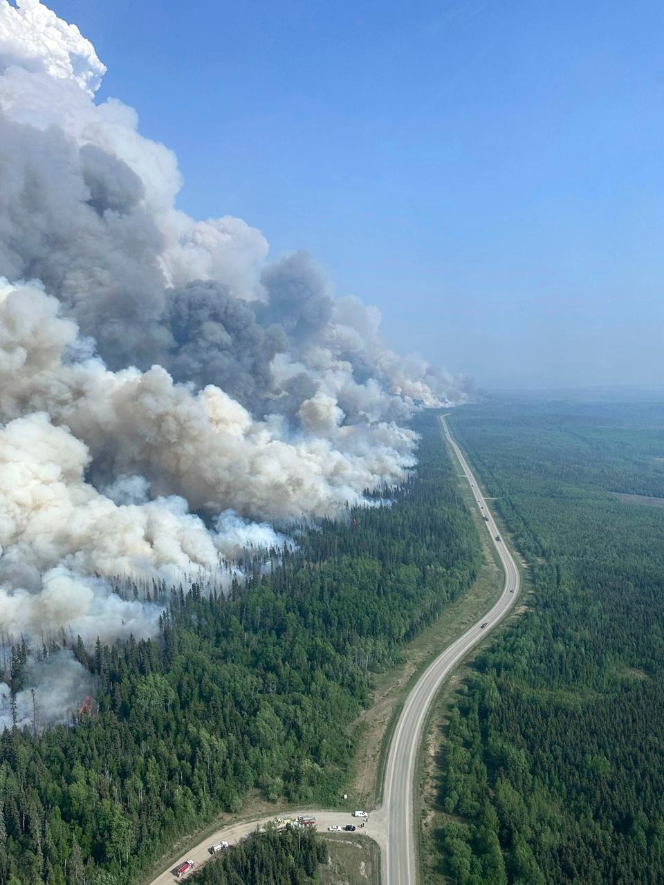 In this photo released by the British Columbia Wildfire Service, a 2,000 hectares planned ignition is successfully completed on the Stoddart Creek wildfire, on Saturday, May 20, 2023, in Stoddart Creek, British Columbia. The operation achieved its objective of removing unburnt, highly susceptible understory fuels and timber between the fire's westernmost edge and Highway 97 and has reduced the likelihood of further spread west across the highway.