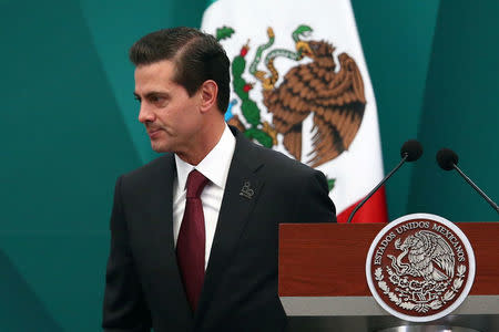 FILE PHOTO: Mexico's President Enrique Pena Nieto is pictured during the 80th anniversary of the expropriation of Mexico's oil industry in Mexico City, Mexico March 16, 2018. REUTERS/Edgard Garrido