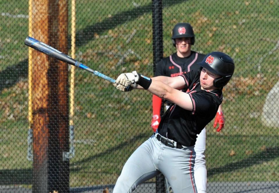 North Quincy's Tim Toland cracks a hit against Weymouth during high school baseball at Libby Field in Weymouth, Tuesday, April 4, 2023.