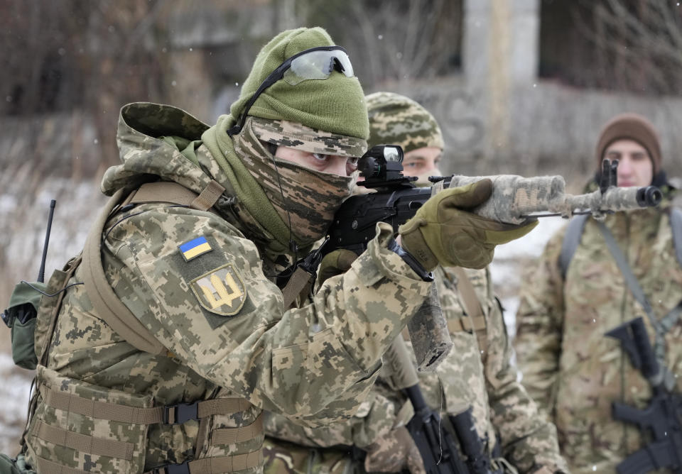 Members of Ukraine's Territorial Defense Forces, volunteer military units of the Armed Forces, train close to Kyiv, Ukraine, Saturday, Jan. 29, 2022. Dozens of civilians have been joining Ukraine's army reserves in recent weeks amid fears about Russian invasion. (AP Photo/Efrem Lukatsky)