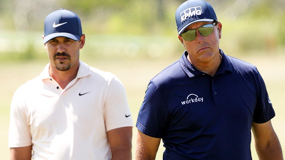 Brooks Koepka and Phil Mickelson, pictured here during the final round of the PGA Championship.