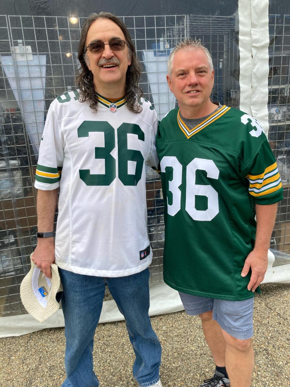 Green Bay Packers fans Carl Jensen, left, and Marvin Vissers from Wisconsin had a special reason for attending LeRoy Butler’s induction to the Pro Football Hall of Fame. Butler loves to cook and he showed at Visser’s house with a macaroni and cheese dinner he made for the family just before Visser’s wife, Margaret, who is Jensen’s sister, passed away from breast cancer.