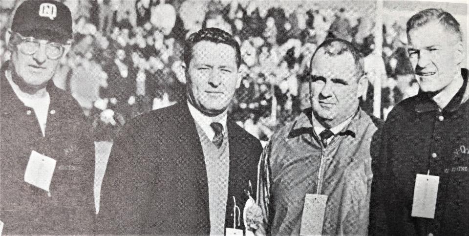 Lloyd Hill, far right, when he was a line coach at North Quincy High School. With him, from left, are Ken Sadowski, Ralph Frazier and Nobby Nolan.