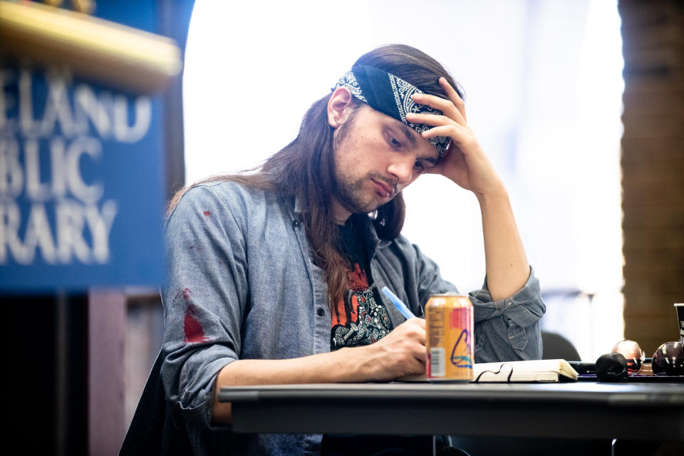 Tim Faust takes notes during a town hall meeting held by the Cleveland chapter of the Democratic Socialists of America explaining Medicare for All. (Photo: Angelo Merendino for Yahoo News)