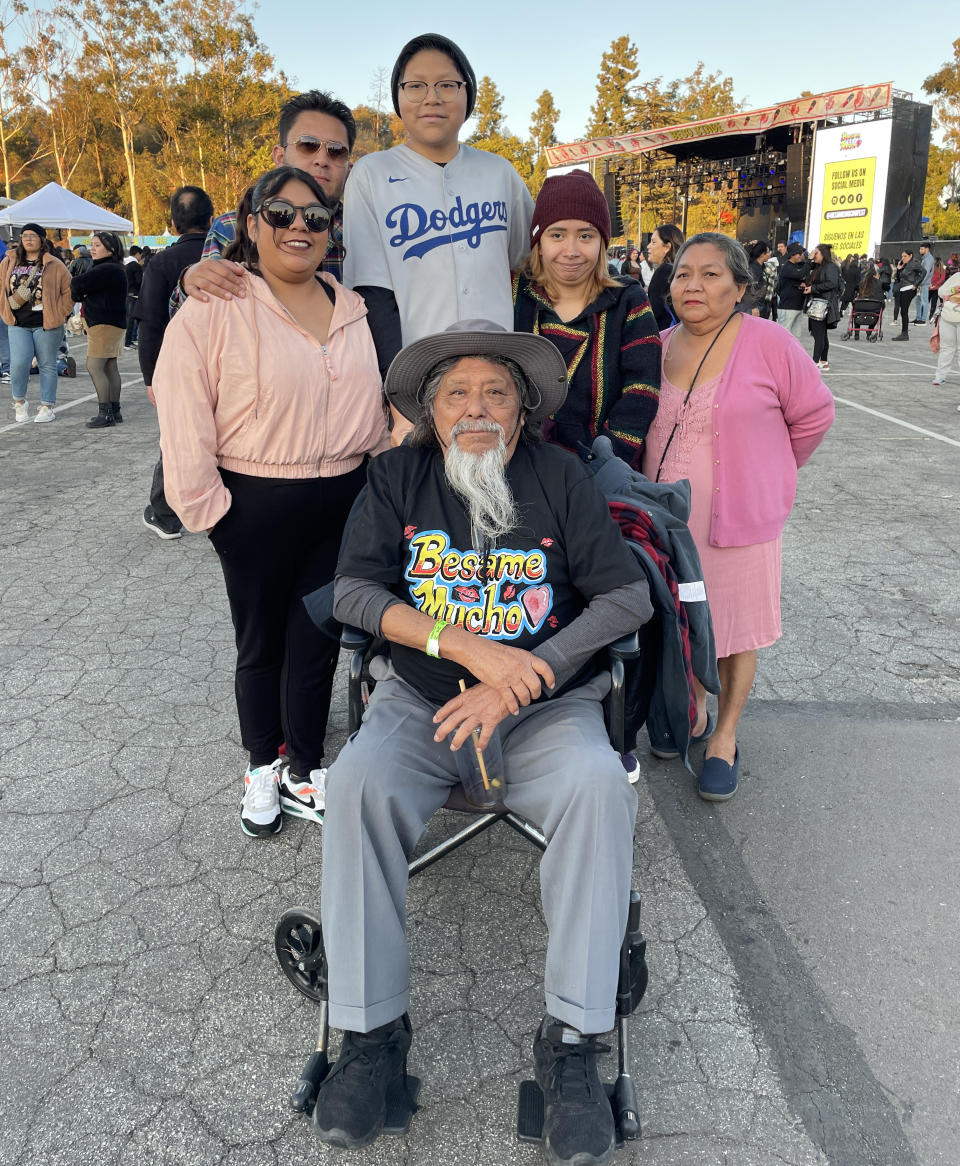 Motivated by his parents' love of music, Pedro May brought his parents, siblings and girlfriend to the festival.  (Edwin Flores / NBC News)