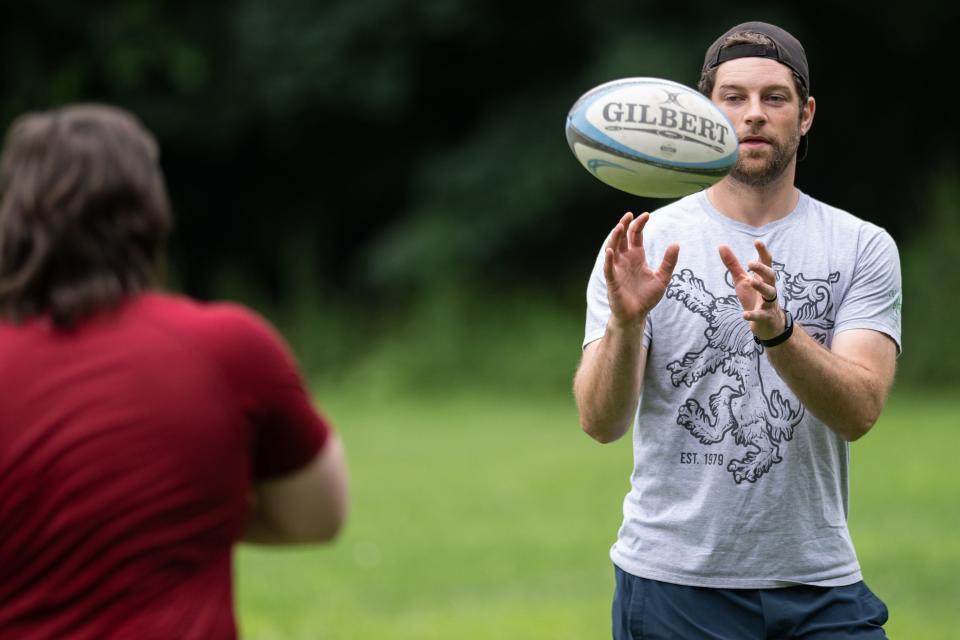 Worcester Rugby Club captain Ryan Adams catches the ball during a practice on Wednesday.