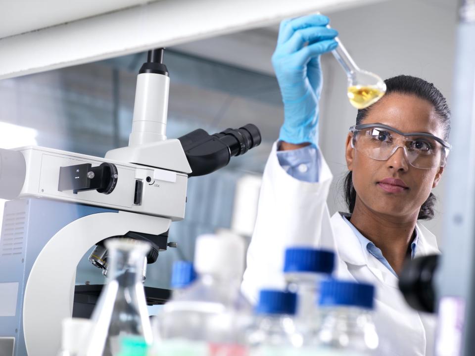 Scientist mixing a chemical formula in a lab