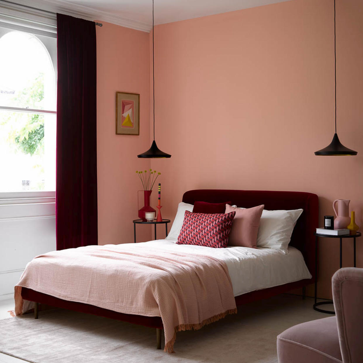  Coral bedroom with two pendant lights. 