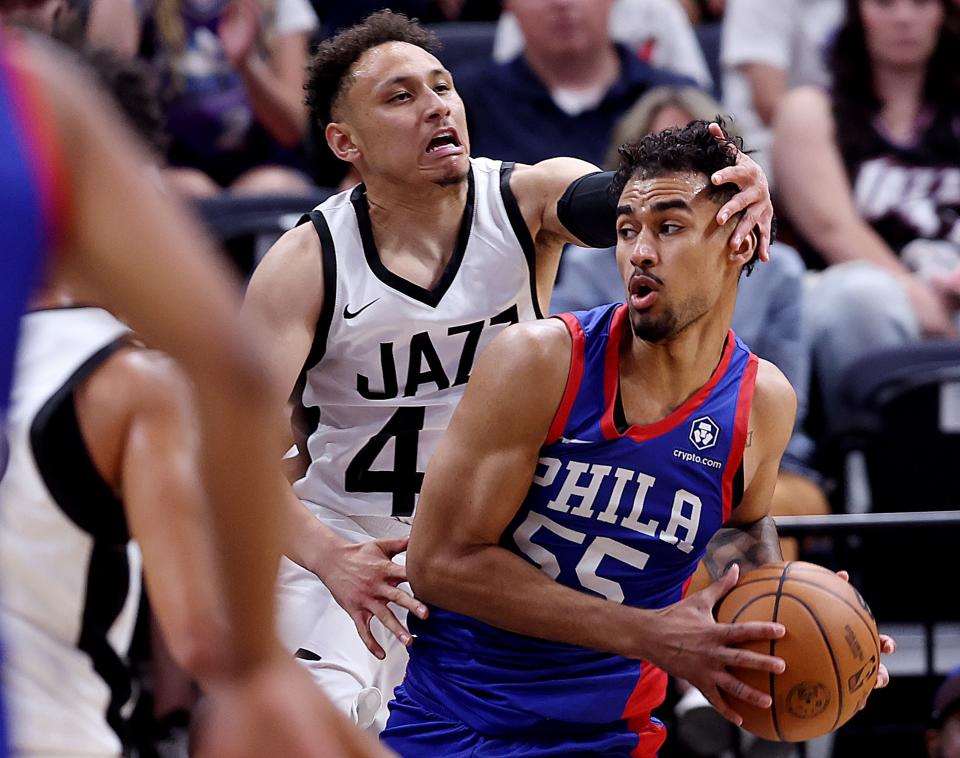 Utah Jazz guard Colbey Ross (44) drags Philadelphia 76ers Jordan Tucker (55) by the head during a play as the Utah Jazz and Philadelphia 76ers play in Summer League action at the Delta Center in Salt Lake City on Wednesday, July 5, 2023. 76ers won 104-94. | Scott G Winterton, Deseret News