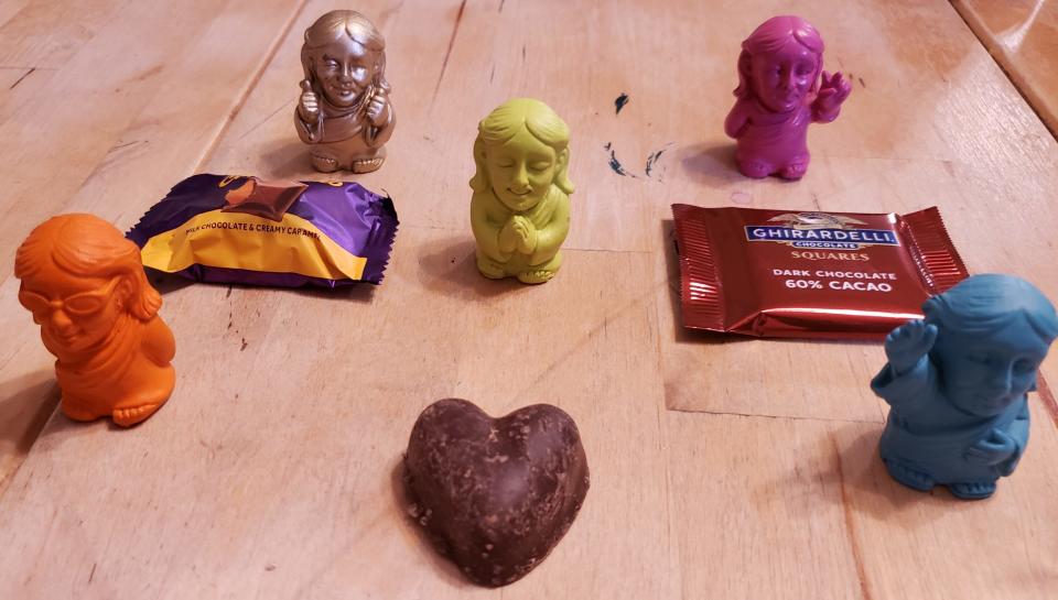 Jesus figurines and chocolate. Ash Wednesday and Valentine’s Day fall on the same day, Feb. 14, 2024.