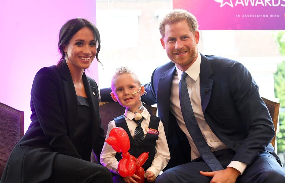 Meghan, Duchess of Sussex and Prince Harry, Duke of Sussex meet four-year-old Mckenzie Brackley during the annual WellChild awards