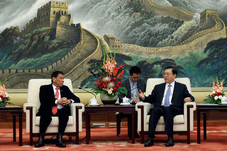 Philippines President Rodrigo Duterte (L) and Zhang Dejiang, Chairman of the Standing Committee of the National People's Congress of China hold a meeting at the Great Hall of the People in Beijing, China, October 20 2016. REUTERS/Wu Hong/Pool