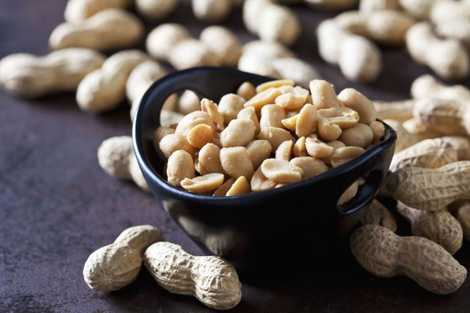 Bowl of salted peanuts | Getty