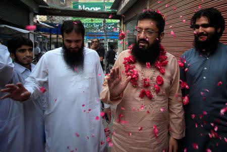 Mohammad Yaqoob Sheikh, nominated candidate of political party, Milli Muslim League (MML) gestures during an election campaign for the National Assembly NA-120 constituency in Lahore, Pakistan July 12, 2018. Picture taken July 12, 2018. REUTERS/Mohsin Raza