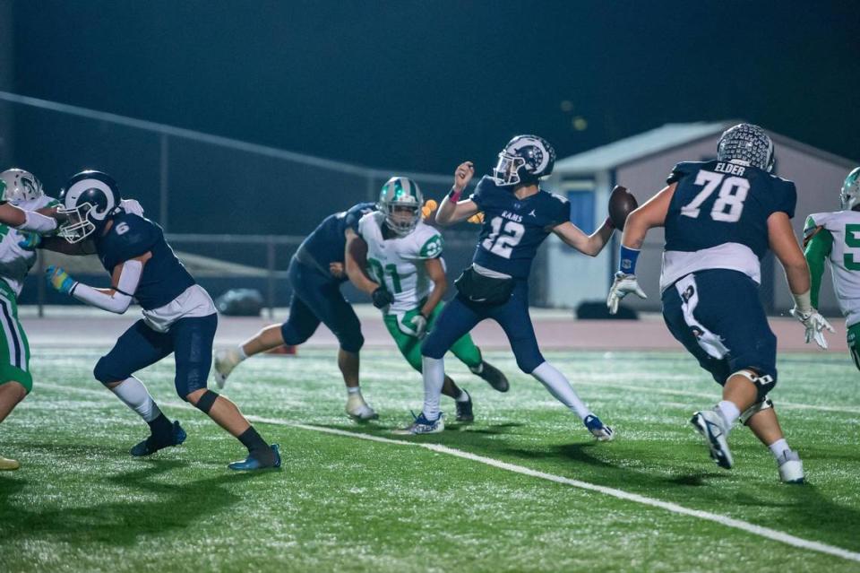 Casa Roble Rams quarterback Connor Campbell (12) makes a 70 yard pass for a touchdown during the fourth quarter against the Dixon Rams in Orangevale in 2022.