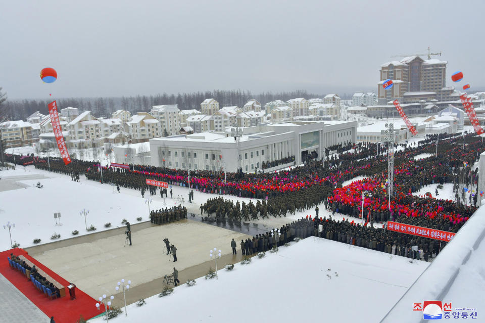 This Monday, Dec. 2, 2019, photo provided Tuesday, Dec. 3, 2019, by the North Korean government shows the completion ceremony of new city Samjiyon being held. On Monday, North Korean leader Kim Jong Un visited Samjiyon county at the foot of Mount Paektu to attend a ceremony marking the completion of work that has transformed the town to “an epitome of modern civilization,” KCNA said. It said the town has a museum on the Kim family, a ski slope, cultural centers, a school, a hospital and factories. Independent journalists were not given access to cover the event depicted in this image distributed by the North Korean government. The content of this image is as provided and cannot be independently verified. Korean language watermark on image as provided by source reads: "KCNA" which is the abbreviation for Korean Central News Agency. (Korean Central News Agency/Korea News Service via AP)