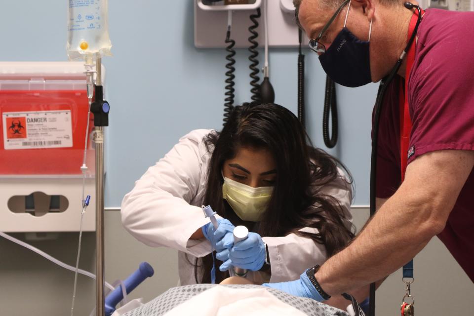 Saint Elizabeth University student Gifty Jose practices opening the airways on a patient simulation manikin as she is taught by Dr. Nicholas Palmieri. Private colleges are starting new degree programs that tap particular needs in the job market as a way to attract students.