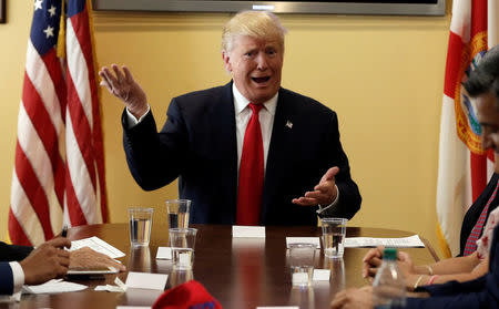 U.S. Republican presidential nominee Donald Trump meets with local small business leaders before a campaign rally in West Palm Beach, Florida, U.S., October 13, 2016. REUTERS/Mike Segar