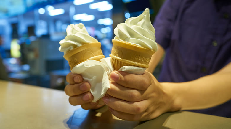 Person holding McDonald's ice cream