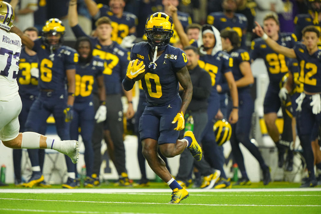 College Football: CFP National Championship: Michigan Mike Sainristil (0) in action, runs with the football after an interception vs Washington at NRG Stadium. Houston, TX 1/8/2024 CREDIT: Erick W. Rasco (Photo by Erick W. Rasco/Sports Illustrated via Getty Images) (Set Number: X164476 TK1)