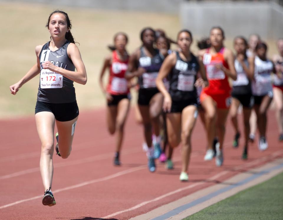 Randall's Cameron McConnell leads the 800 meter run during the Region I-5A track and field meet, Saturday, April 30, 2022, at Lowrey Field at PlainsCapital Park. McConnell placed first.